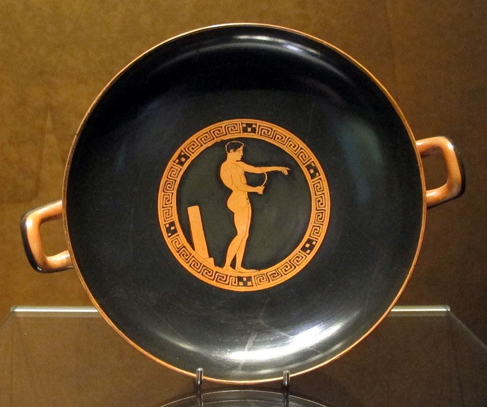 Ancient Greek athlete cleaning himself with a strigil